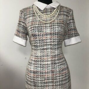 vintage 1950s dress with a tweed plaid pattern and attached pearls